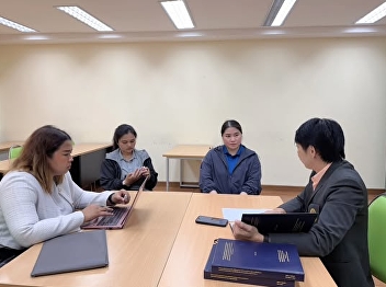 Thai Master's Degree students consulted
with their thesis advisor,